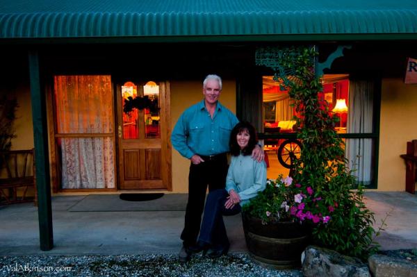 Hosts Leya and Scotty in front of lodge web